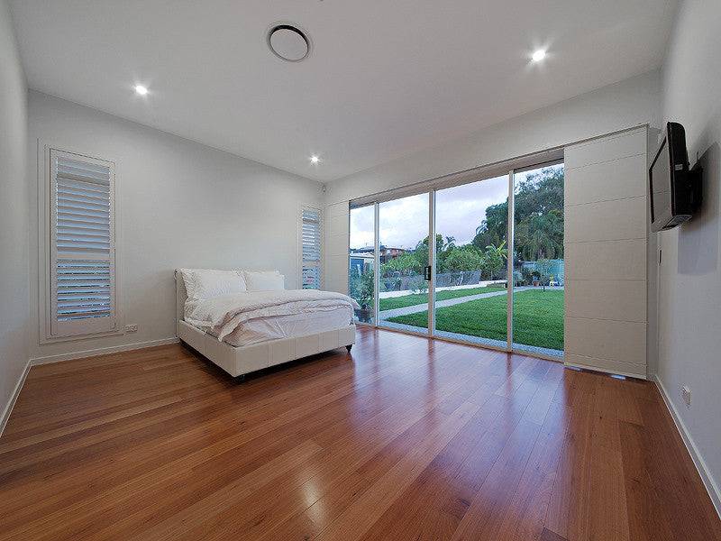 Traditional Australian House Design T4011 showcasing a classic exterior with modern architectural details and lush landscaping.