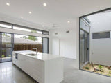 Australian House Design Group D3002 duplex exterior with modern architectural features and landscaped front yard.
