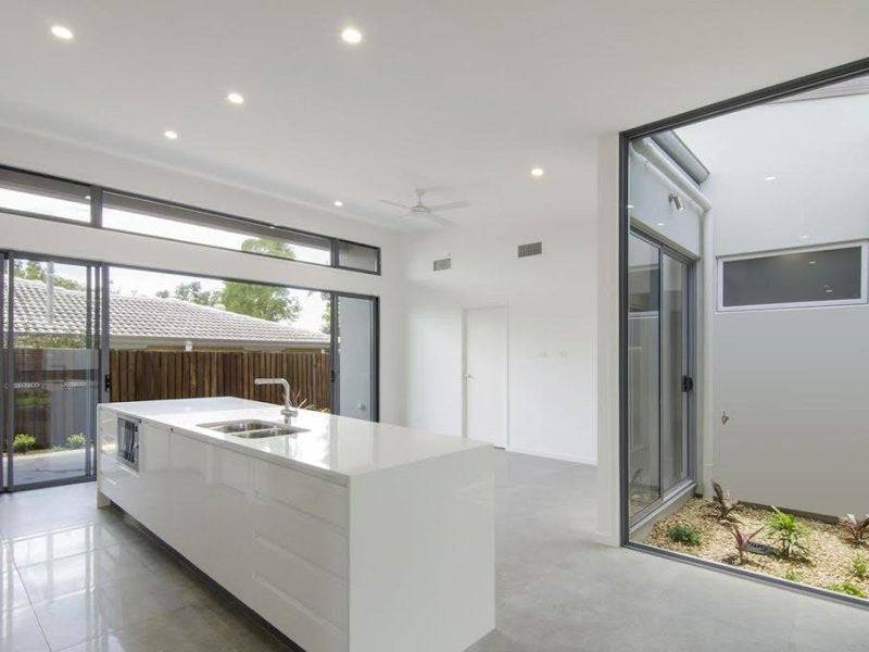 Australian House Design Group D3002 duplex exterior with modern architectural features and landscaped front yard.